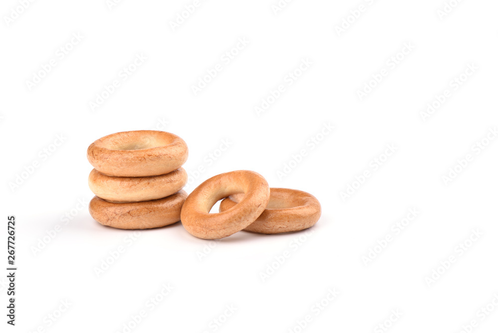 Several crispy bagels isolated on white background. Several crispy bagels isolated on white background.