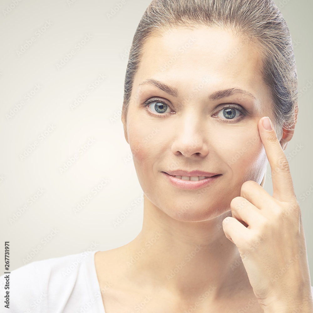 Woman point at dermatology skin problem. Cosmetology beauty girl portrait. Face care procedure