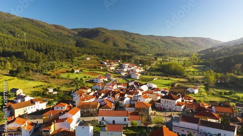 Aerial view of small town with red roofs during sunrise time. Top View of Valhelhas village in central Portugal
