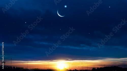 Crescent moon with beautiful sunset background . Generous Ramadan . Light from sky . Religion background .  