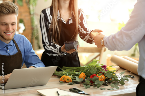 Customer paying for order in flower shop