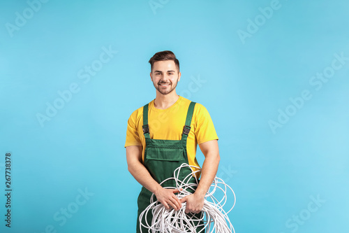 Male electrician on color b...
