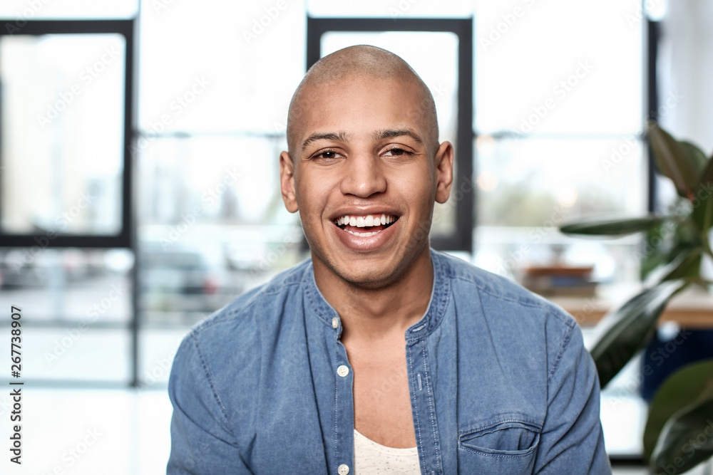 Portrait of handsome African-American man at home