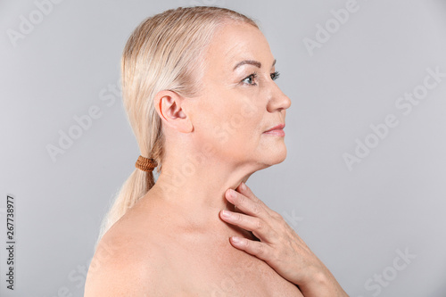 Mature woman on light backg...