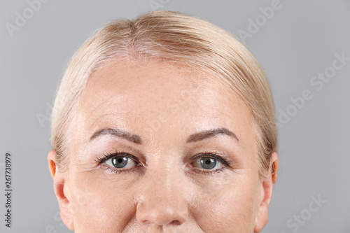 Mature woman on light backg...