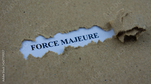 Torn paper with text force majeure photo