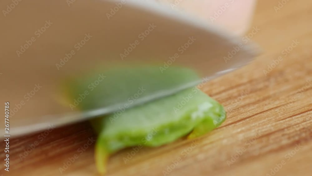 chopping, cutting aloe leaf on wooden board, showing pulp, liquid, gelly chopping, cutting aloe leaf on wooden board, showing pulp, liquid, gelly