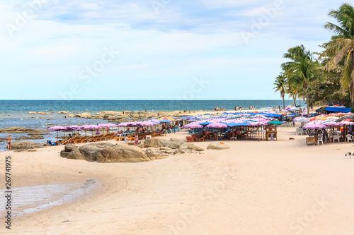 Beach umbrellas and tourists on the beach
