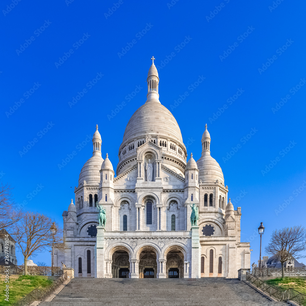     Paris, basilica Sacre-Coeur, touristic monument in blue sky 