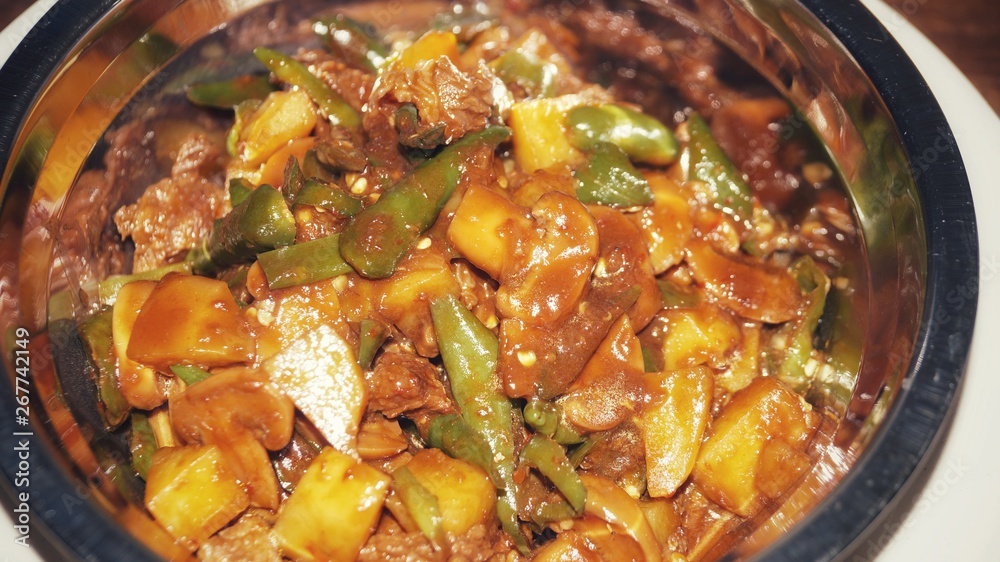 Chicken with black sauce (Ayam masak kicap) - A kind of Malay traditional dish. Selective focus. Chicken with black sauce (Ayam masak kicap) - A kind of Malay traditional dish. Selective focus.