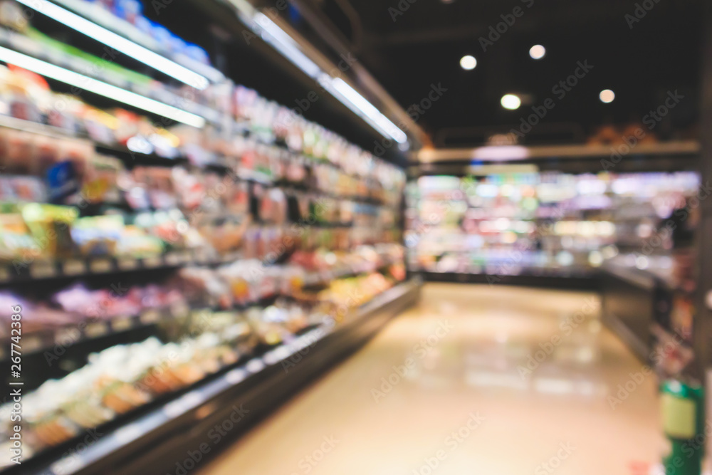 Abstract supermarket aisle interior blurred defocused background with bokeh light