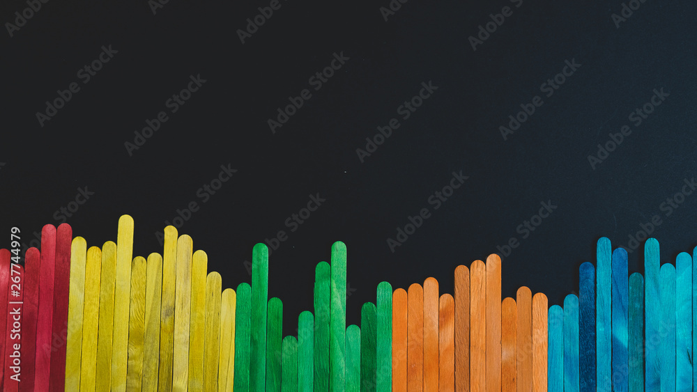 Fototapeta premium Colorful sticks isolated on black background