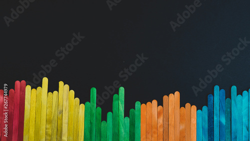 Colorful sticks isolated on black background