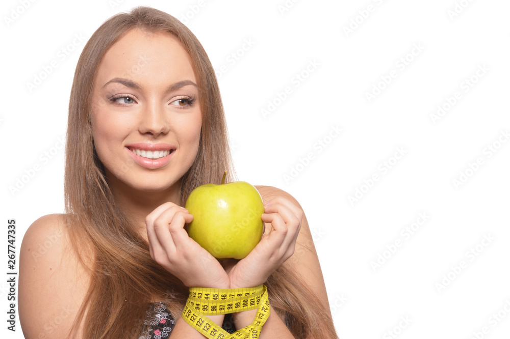 Portrait of beautiful young woman with green apple and measuring tape isolated Portrait of beautiful young woman with green apple and measuring tape isolated