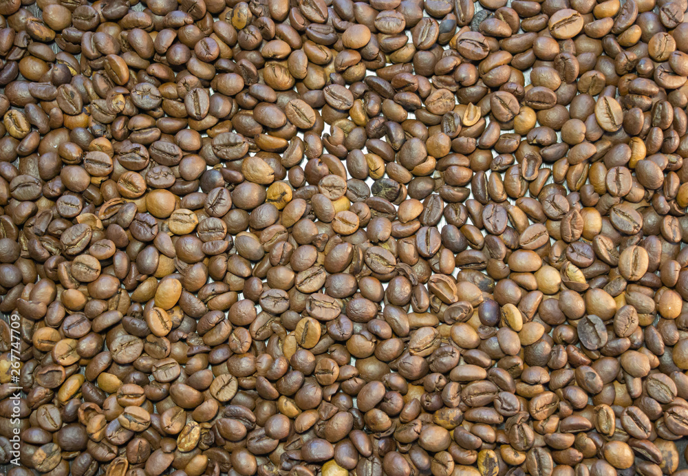 Cup of coffee beans, Scattered coffee beans around the cup Cup of coffee beans, Scattered coffee beans around the cup