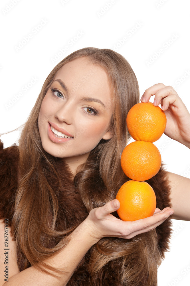 Portrait of young woman posing with oranges isolated Portrait of young woman posing with oranges isolated