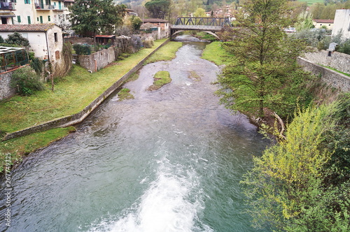 The torrent Comano in the village of Dicomano, Tuscany, Italy photo