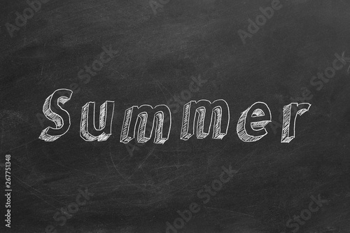 Hand drawing text "Summer" on blackboard