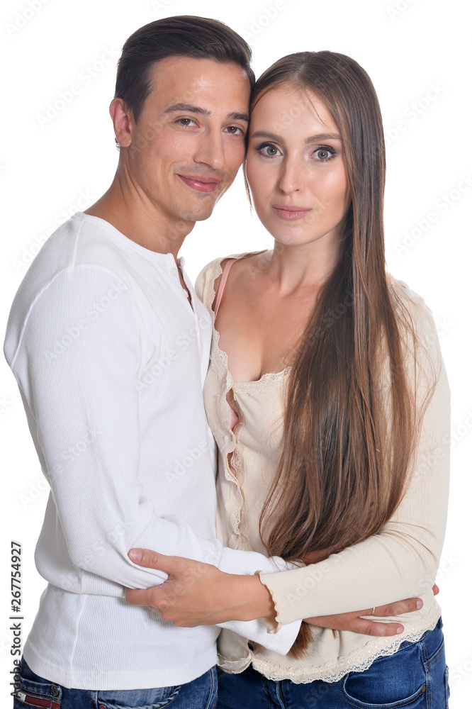 Portrait of happy young couple posing on white background Portrait of happy young couple posing on white background
