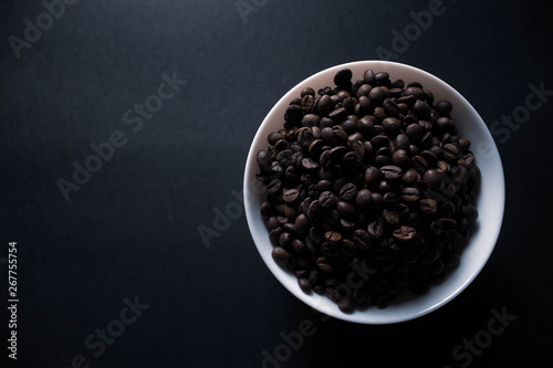 plate with coffee on black background with copy space