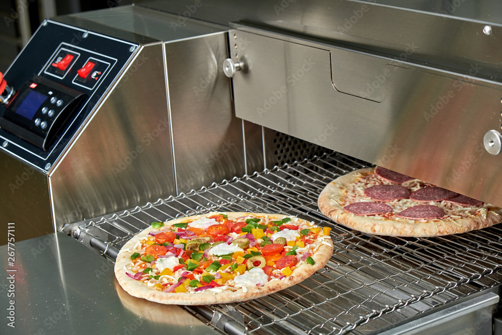 Industrial electric pizza oven for catering. Professional kitchen equipment  Stock Photo | Adobe Stock