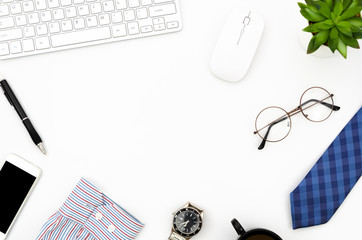 Flat lay white working desk with laptop computer, smartphone and men's accesoaries. White copy space in the middle for father's day greeting text