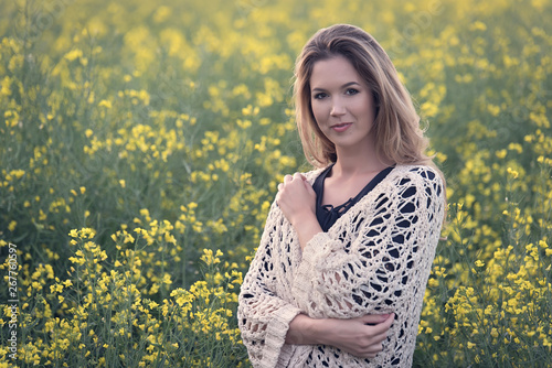 Beautiful woman in rapeseed field