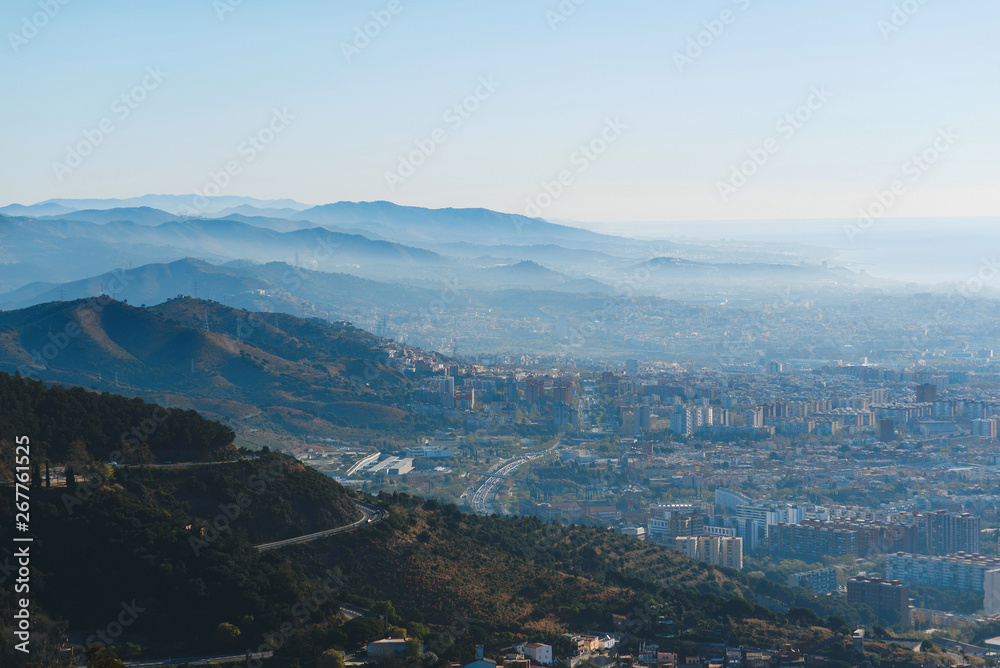 barcelona and hills in smog