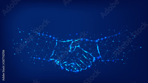 Handshake from triangles and luminous points. Concept of a successful business project. Background of beautiful dark blue night sky.