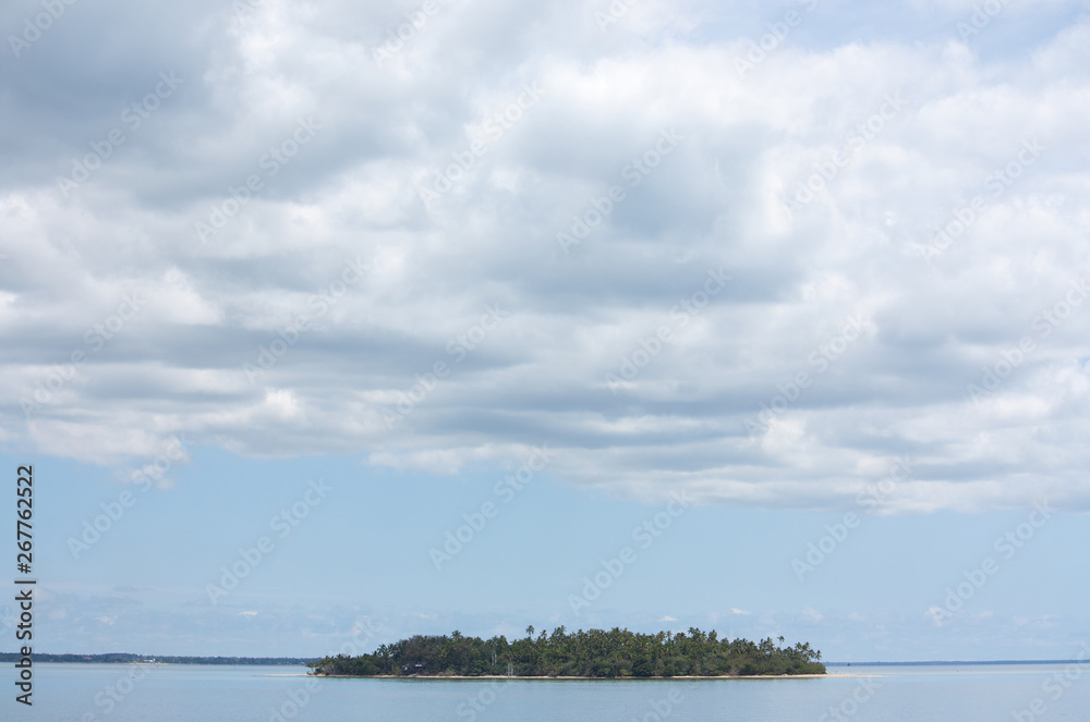 A lonely island and a vast sky in the tropical Tonga