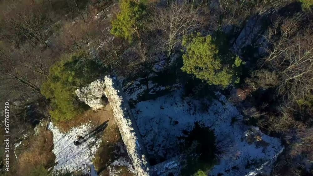 Aerial: Flying over misterious ancient building ruins on top of the hill. Filmed on hiking trip in nature on beautiful sunny winter day. Aerial: Flying over misterious ancient building ruins on top of the hill. Filmed on hiking trip in nature on beautiful sunny winter day.