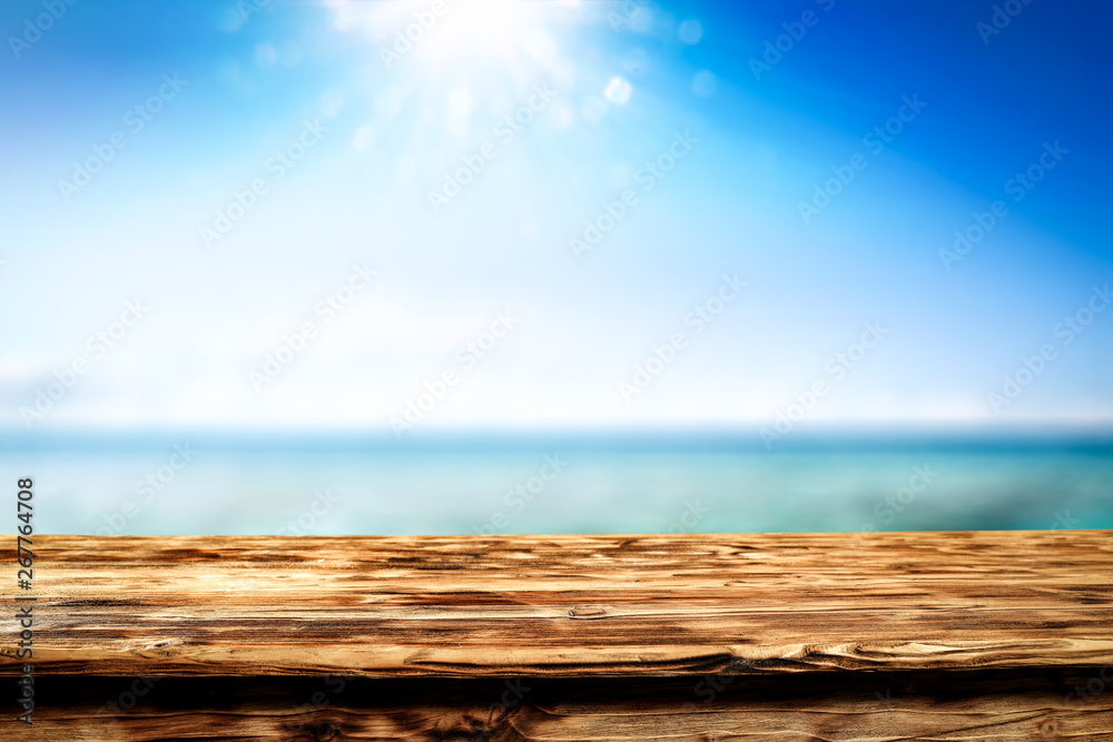 Desk of free space and summer background of sea 