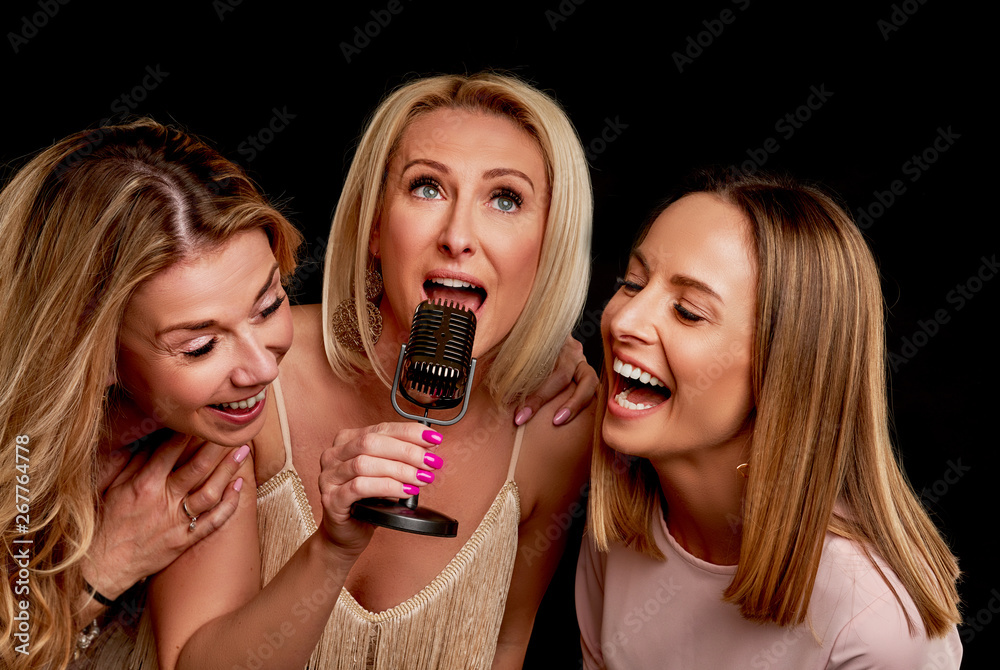 Group of friends partying in a karaoke club Group of friends partying in a karaoke club