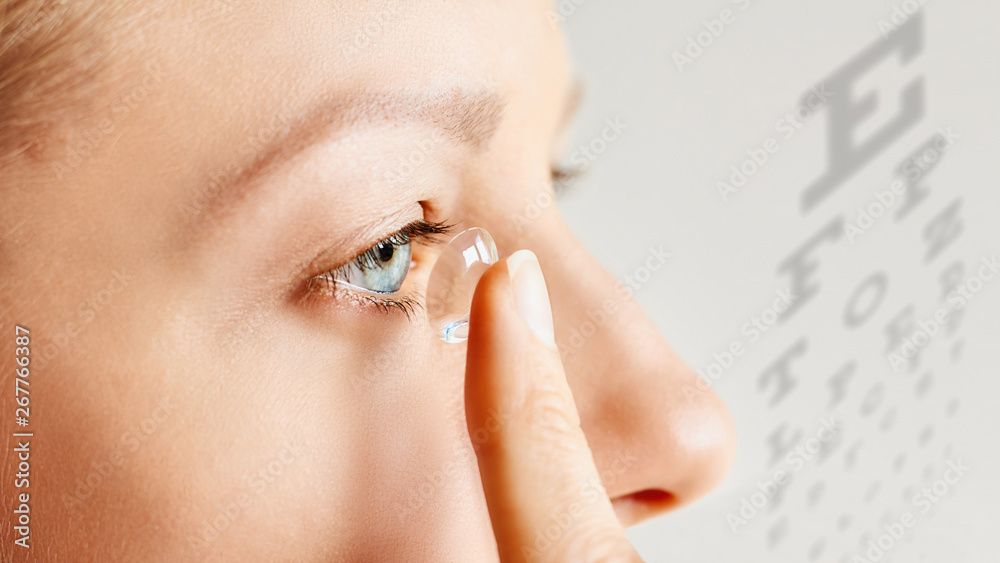 © Olesia - Young woman puts contact lens in her eye. Eyewear, eyesight and vision, eye care and health, ophthalmology and optometry concept, selective focus © Olesia - Young woman puts contact lens in her eye. Eyewear, eyesight and vision, eye care and health, ophthalmology and optometry concept, selective focus