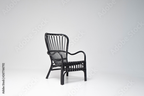 Modern black armchair on the white background
