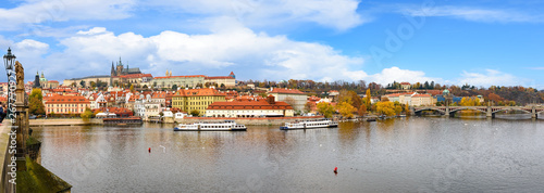 river,europe,old,town,architecture,city,travel,sky,summer,cityscape,tower,tourist,tourism,castle,history,medieval,blue,day,prague,vltava river,looking at view,scenics - nature,city life,urban skyline,