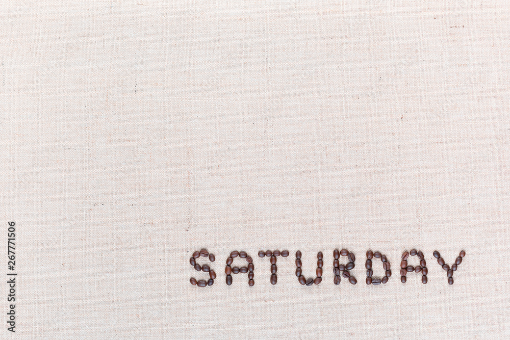 The word Saturday written with coffee beans , aligned at the bottom right.
