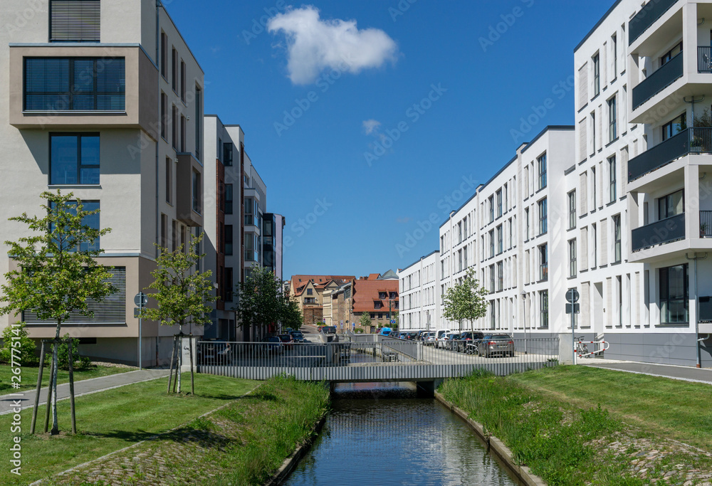modern houses in the vity of rostock - little river in the middle