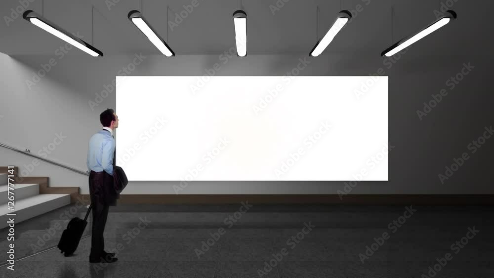 Businessman looking at a screen showing a plane flying Businessman looking at a screen showing a plane flying