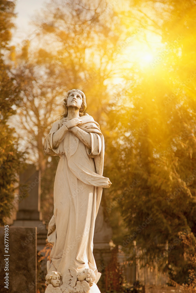 Antique statue of holy Virgin Mary with angels as symbol of pain, suffering and love. Antique statue of holy Virgin Mary with angels as symbol of pain, suffering and love.