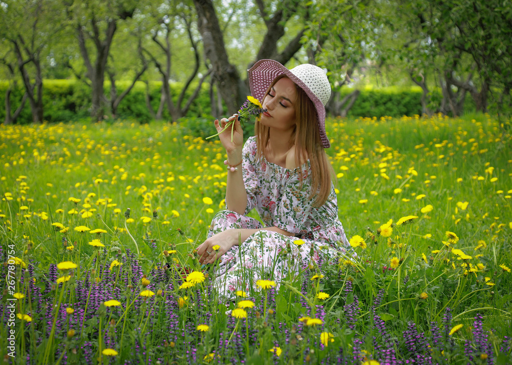Fototapeta premium girl in field of flowers