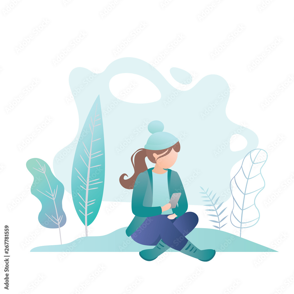 The girl in warm clothes and hat sits with a smartphone in hand, The girl in warm clothes and hat sits with a smartphone in hand,