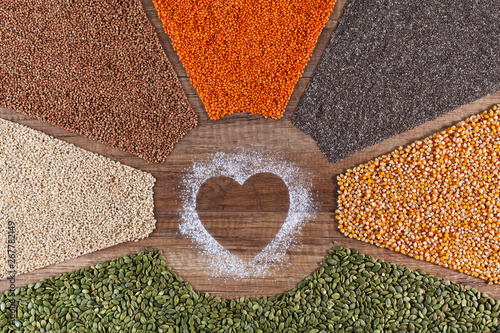 Food with love - plant based diversified diet concept with colorful grains and seeds