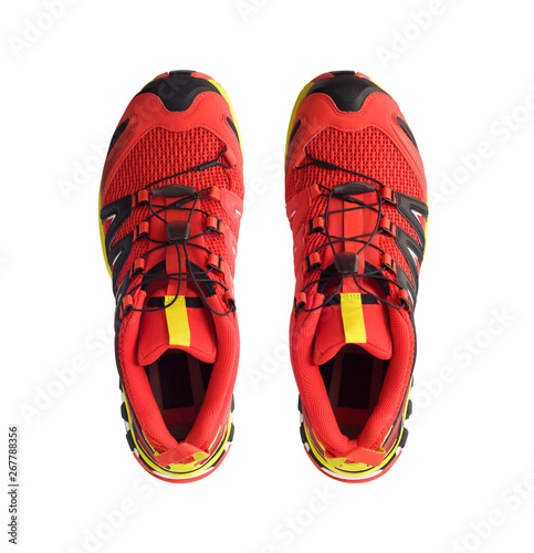 Top view of red trail running shoes isolated on white background
