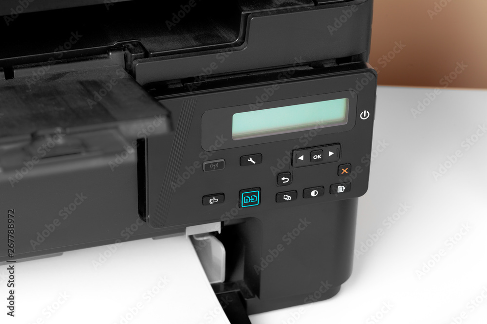 Obraz premium Close up of printer printing documents