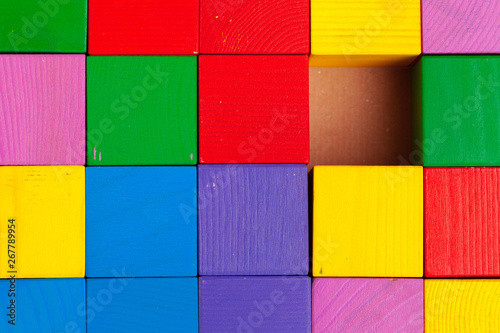 Colorful wooden blocks background, top view