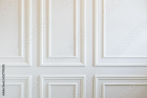 Finishing Works - Fragment Of Classic White Walls With Installed Wall Panels, Decorated With Moldings. photo