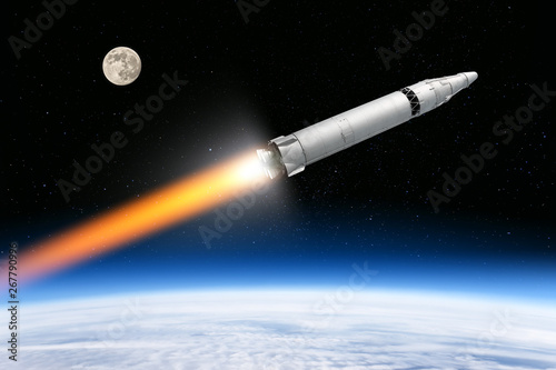 nuclear intercontinental ballistic missile from cold war era flying out of planet earth aerial view of launch silver painted ground to space rocket vehicle with atom warhead nuclear threat concept