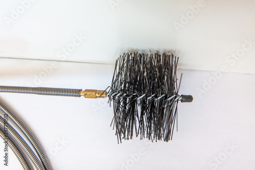 Closeup of the cable for cleaning pipes during plumbing maintenance