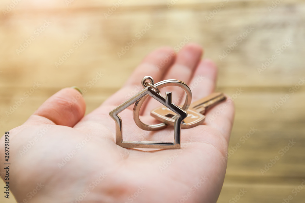 House key with house figure on the hand